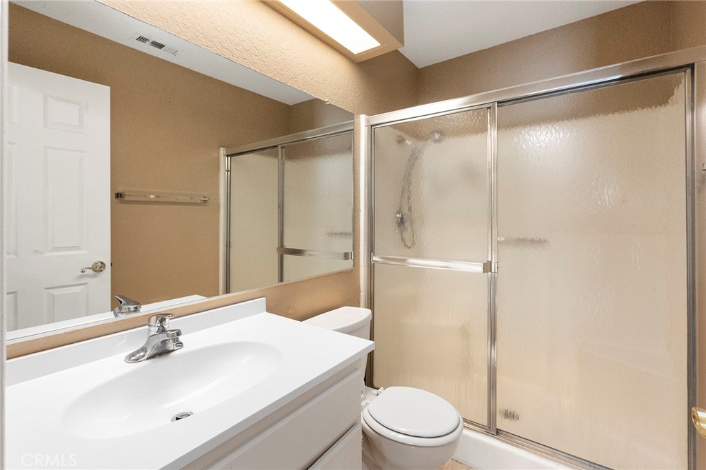 3665 Anchorage Street Hemet, CA 92545 - Photo 19 of 23 a bathroom with a sink mirror shower and toilet