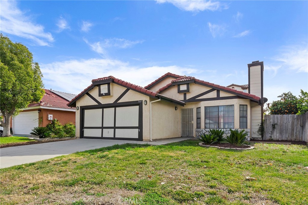 3665 Anchorage Street Hemet, CA 92545 - Photo 2 of 23 a view of a white house next to a yard with large trees
