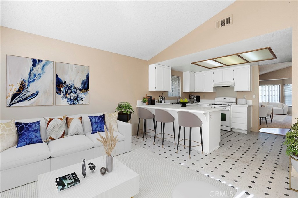 3665 Anchorage Street Hemet, CA 92545 - Photo 9 of 23 a living room with furniture and kitchen view