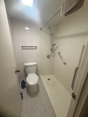 a picture of a hallway with a white wall
