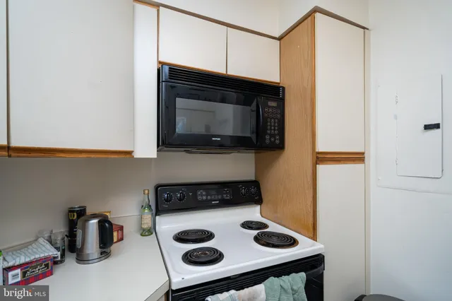 a kitchen with a stove and a microwave