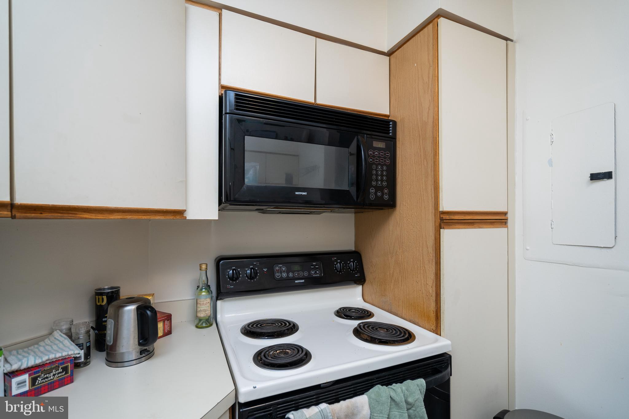 2020 Walnut Street, Unit 19K Philadelphia, PA 19103 - Photo 3 of 17 a kitchen with a stove and a microwave
