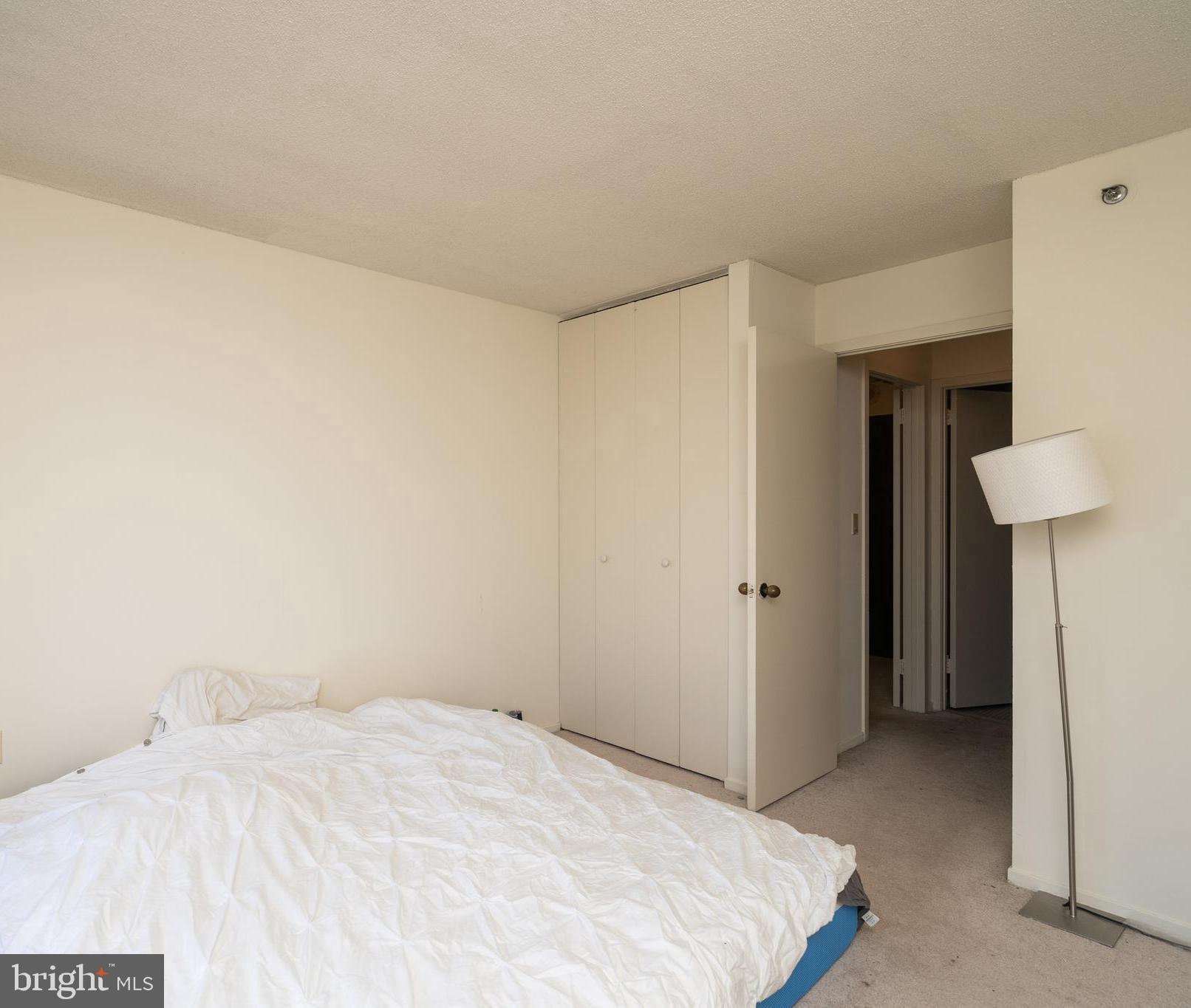 2020 Walnut Street, Unit 19K Philadelphia, PA 19103 - Photo 4 of 17 a bedroom with a bed and a table in it