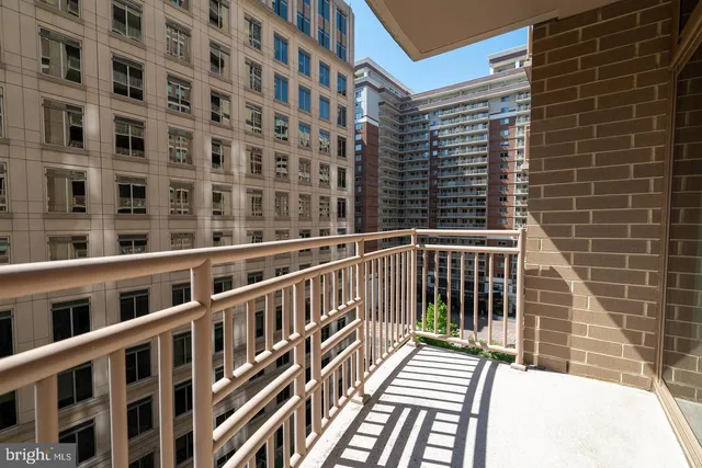 a view of a balcony with a floor to ceiling window