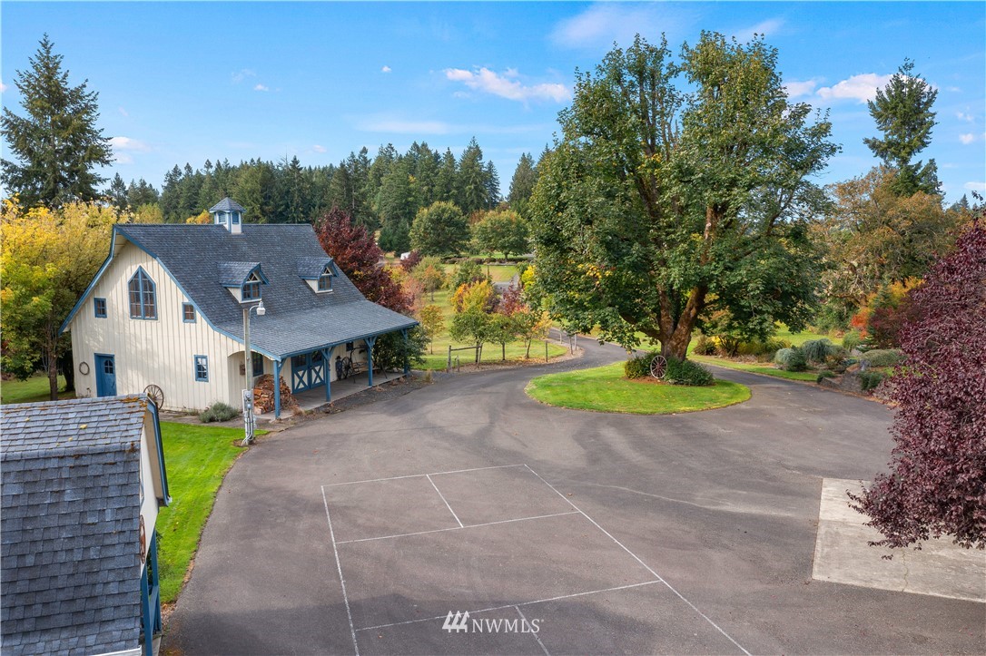 19334 Tall Firs Lane Southwest Rochester, WA 98579 - Photo 4 of 40 a view of a house with a yard