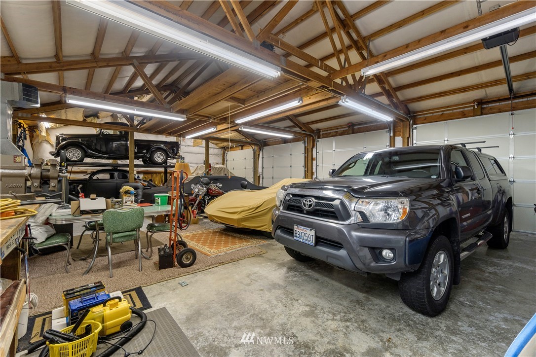 19334 Tall Firs Lane Southwest Rochester, WA 98579 - Photo 31 of 40 a view of car garage