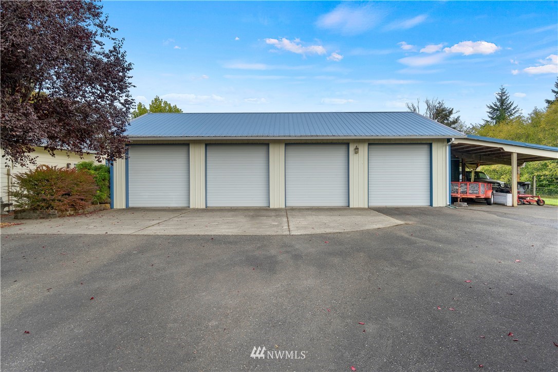 19334 Tall Firs Lane Southwest Rochester, WA 98579 - Photo 6 of 40 a house view with a outdoor space