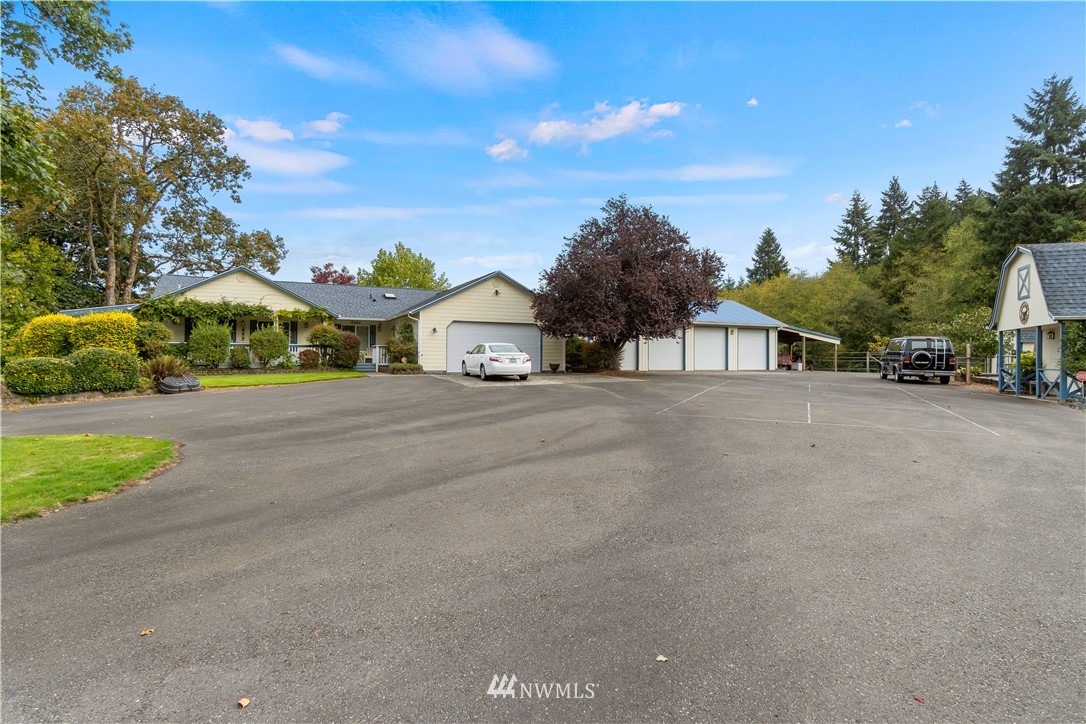 19334 Tall Firs Lane Southwest Rochester, WA 98579 - Photo 7 of 40 a view of street with parked cars
