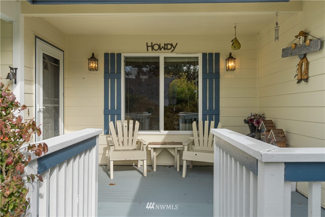 19334 Tall Firs Lane Southwest Rochester, WA 98579 - Photo 8 of 40 a balcony with couple of chairs and a table