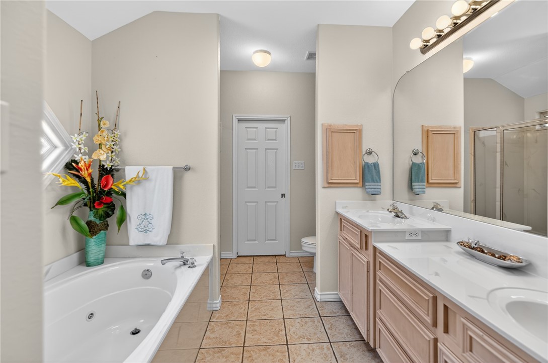 15969 Punta Espada Loop Corpus Christi, TX 78418 - Photo 17 of 40 Primary bath - double sinks & a jet tub.