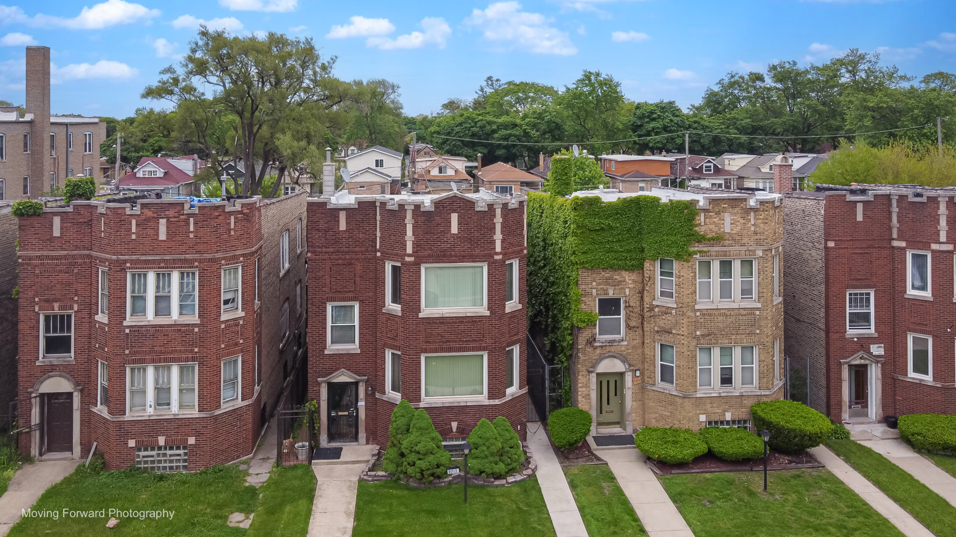 8213 South Indiana Avenue Chicago, IL 60619 - Photo 1 of 25 a view of a brick building next to a yard