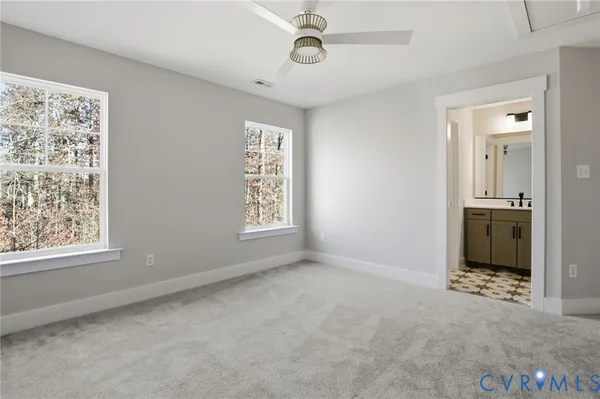 an empty room with windows and closet
