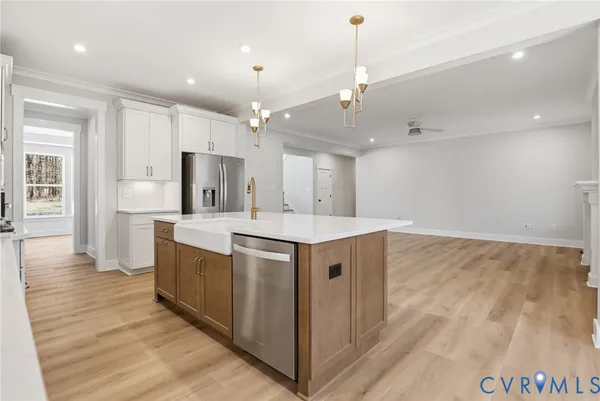 a kitchen with stainless steel appliances granite countertop a stove and a refrigerator