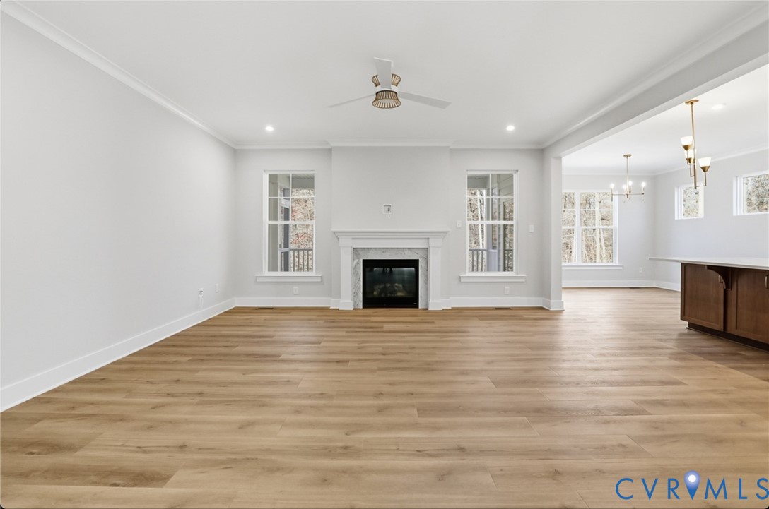 12420 Coalboro Road Chesterfield, VA 23838 - Photo 5 of 19 a view of an empty room with wooden floor and a window