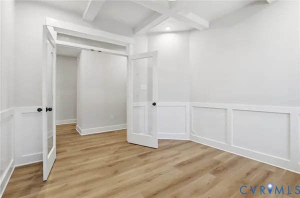 an empty room with wooden floor
