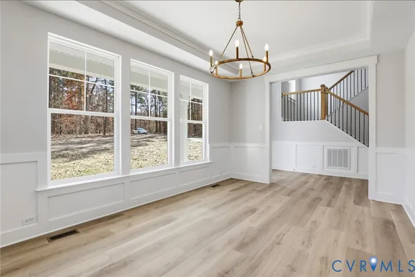 a view of an entryway with wooden floor