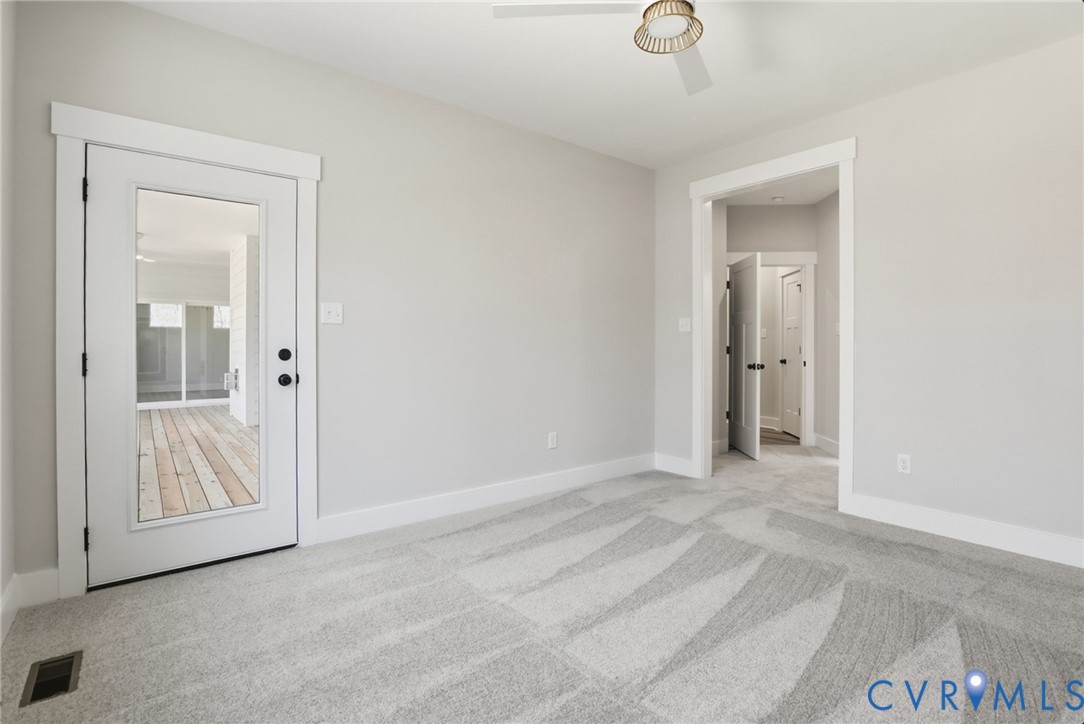 12420 Coalboro Road Chesterfield, VA 23838 - Photo 8 of 19 a view of an empty room with wooden door