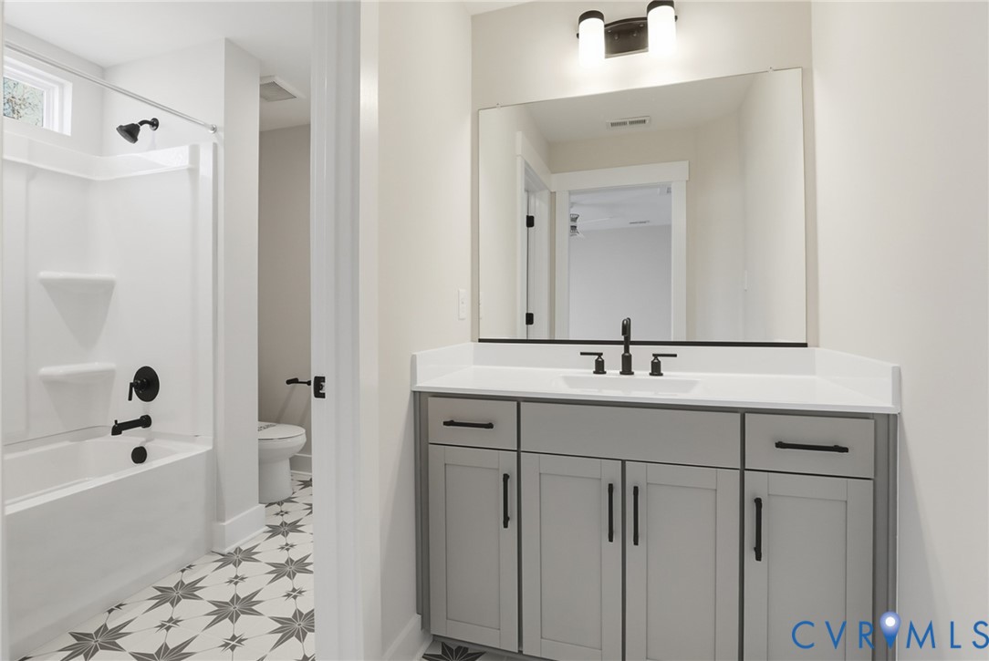 12420 Coalboro Road Chesterfield, VA 23838 - Photo 9 of 19 a bathroom with a sink a toilet and shower