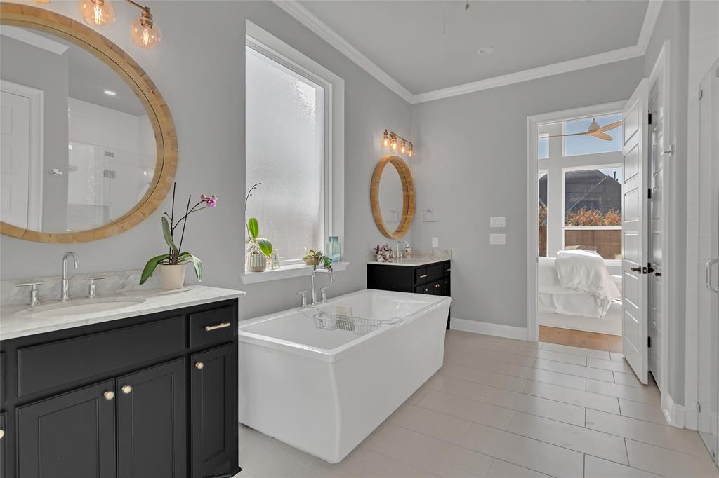 13753 Green Elm Road Fort Worth, TX 76008 - Photo 23 of 40 En-suite primary bath features individual vanities and a deep soaking tub