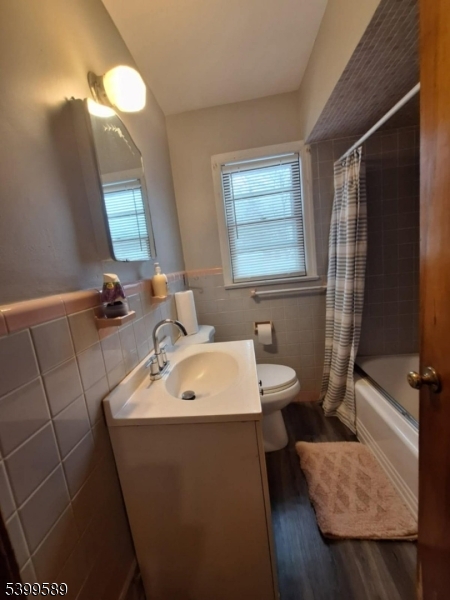 502 Drake Avenue Roselle, NJ 07203 - Photo 17 of 21 a bathroom with a sink a toilet and tub