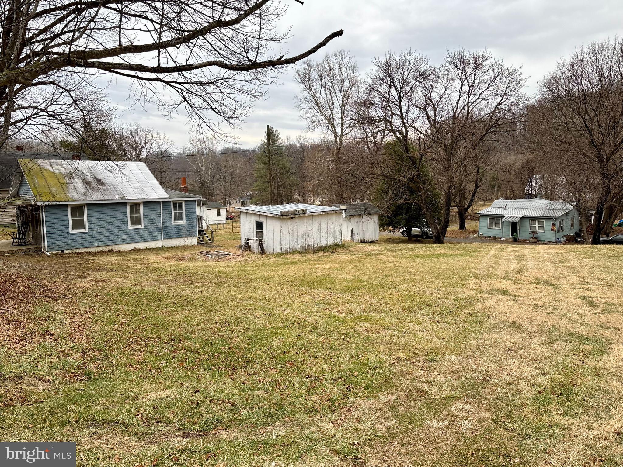 a view of a house with snow on the background