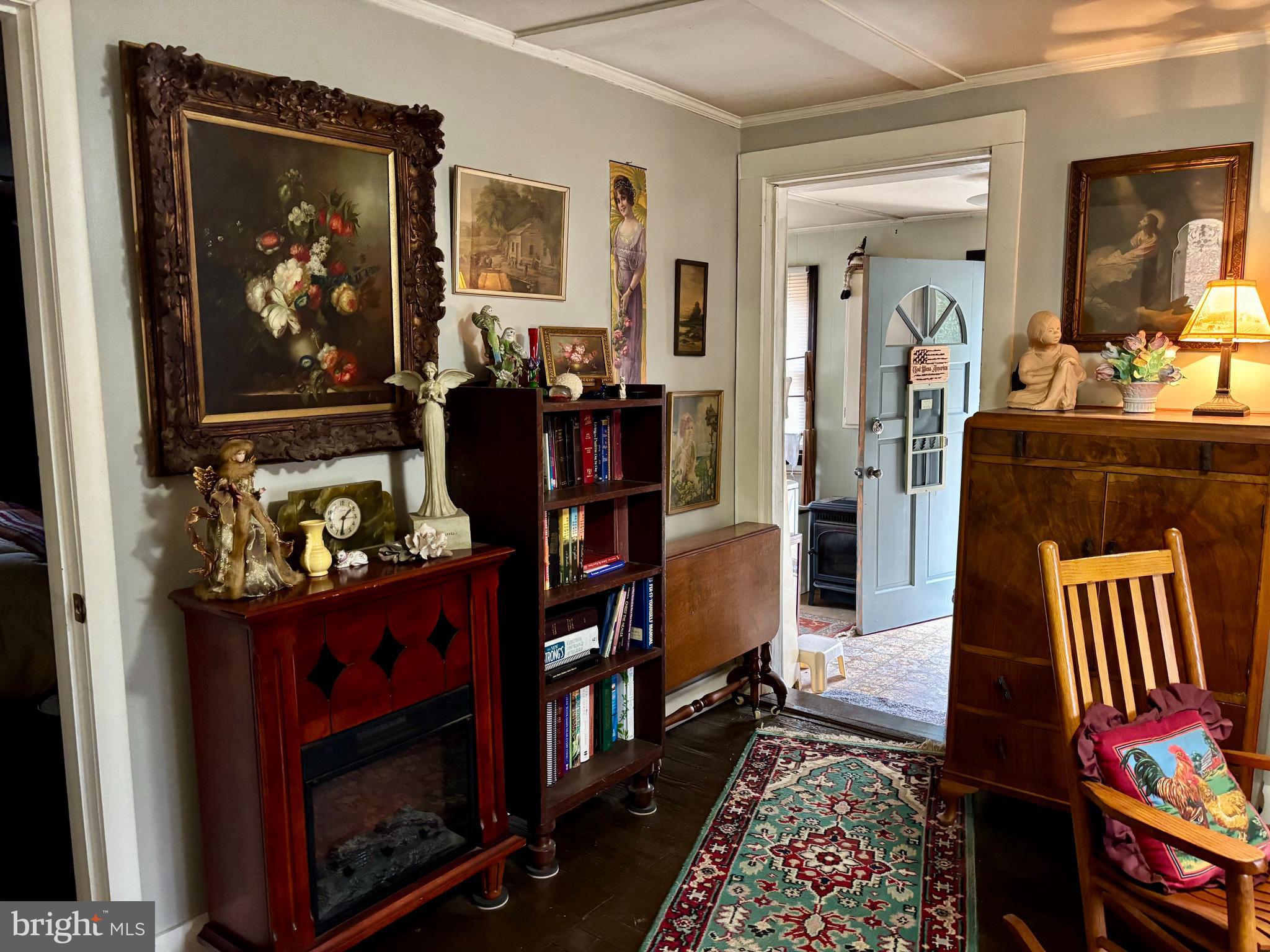 3485 Pine Grove Road Stanley, VA 22851 - Photo 11 of 47 a living room with furniture a rug and a fireplace