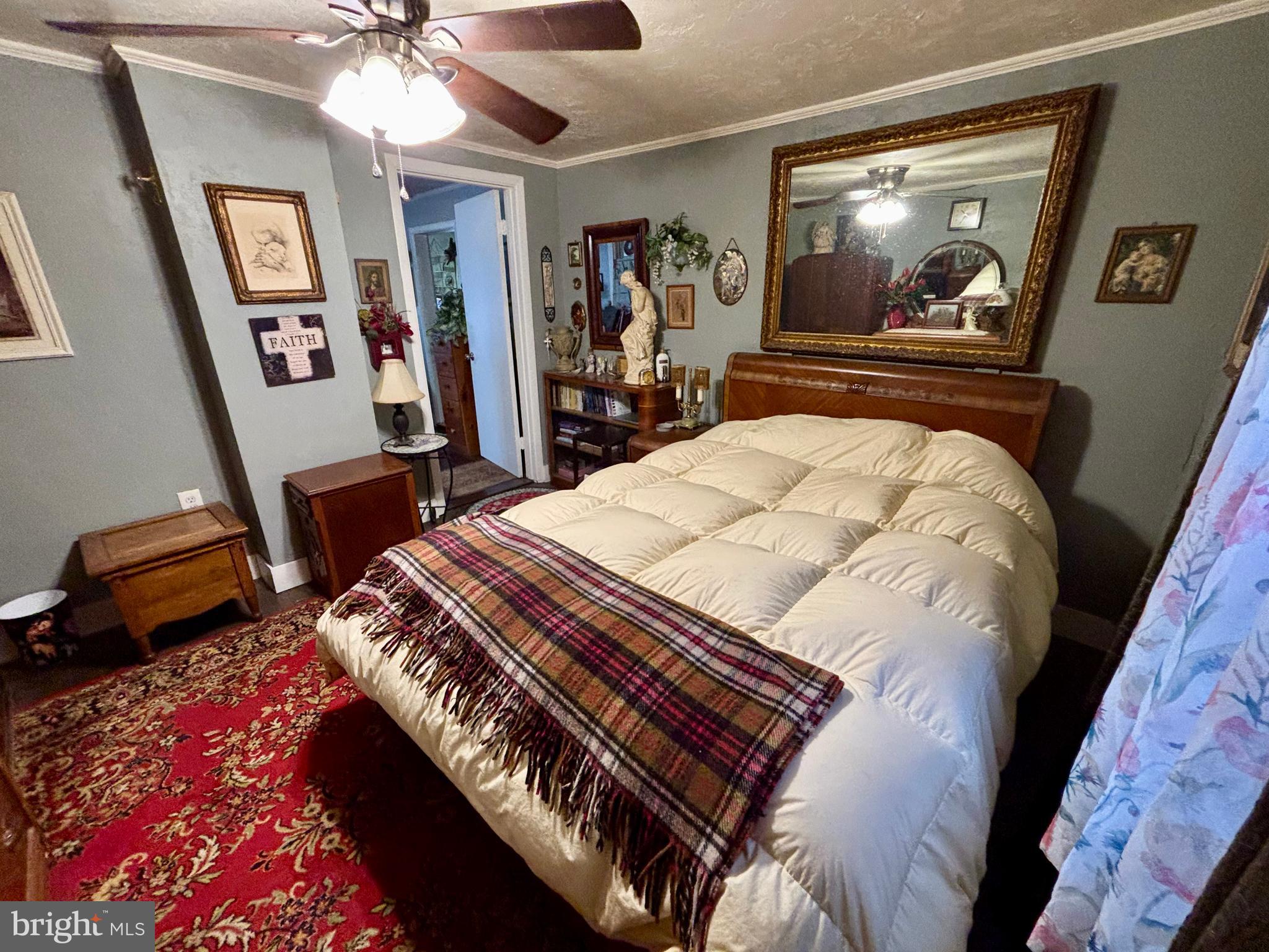 3485 Pine Grove Road Stanley, VA 22851 - Photo 19 of 47 a bedroom with a bed and a flat screen tv