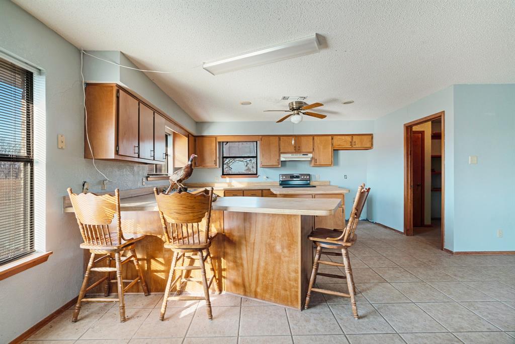 109 Private Road Brookston, TX 75421 - Photo 18 of 26 a view of a dining room with furniture