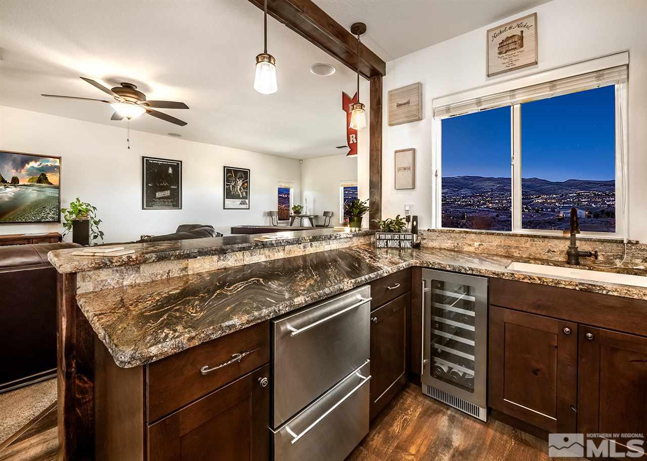 1640 Elk Run Trail Reno, NV 89523 - Photo 14 of 40 a kitchen with stainless steel appliances granite countertop a sink and stove