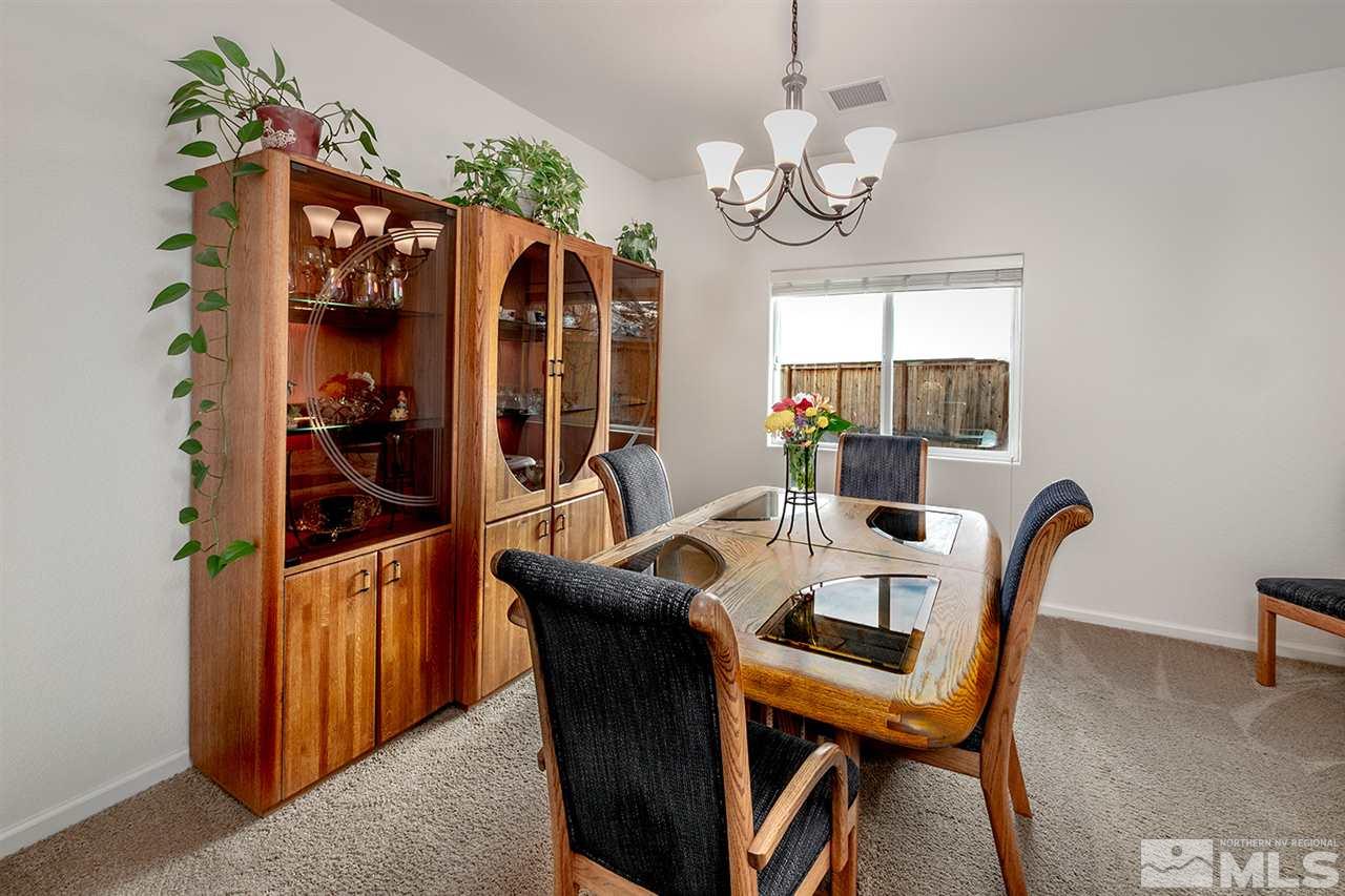 1640 Elk Run Trail Reno, NV 89523 - Photo 23 of 40 a view of a dining room with furniture window and wooden floor