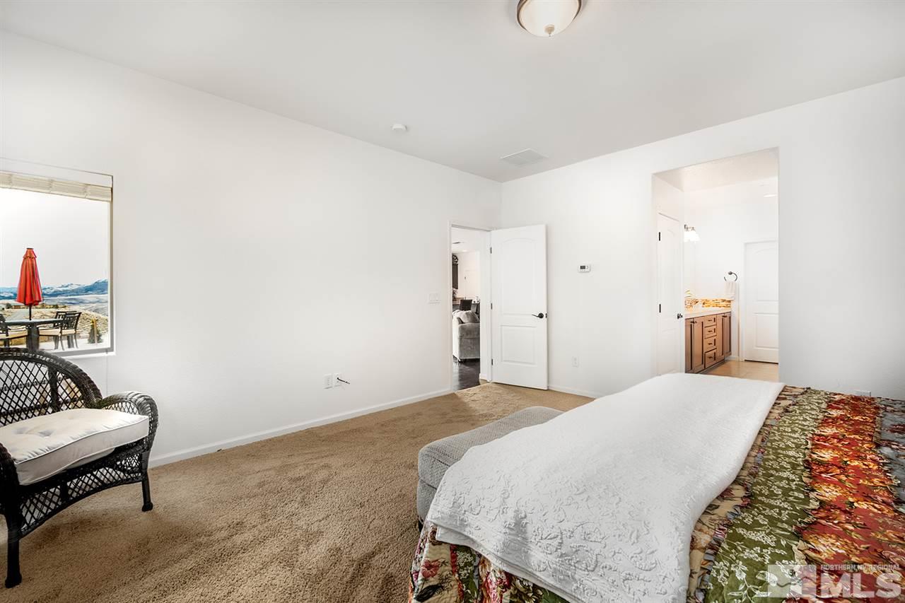 1640 Elk Run Trail Reno, NV 89523 - Photo 25 of 40 a bedroom with a bed and a couch