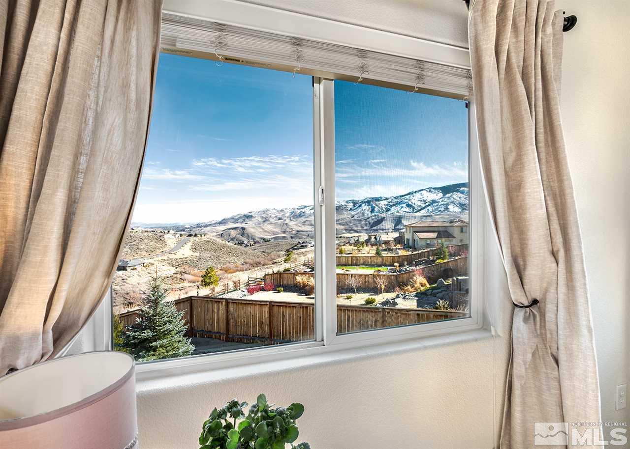 1640 Elk Run Trail Reno, NV 89523 - Photo 32 of 40 a view of a balcony with furniture and a potted plant