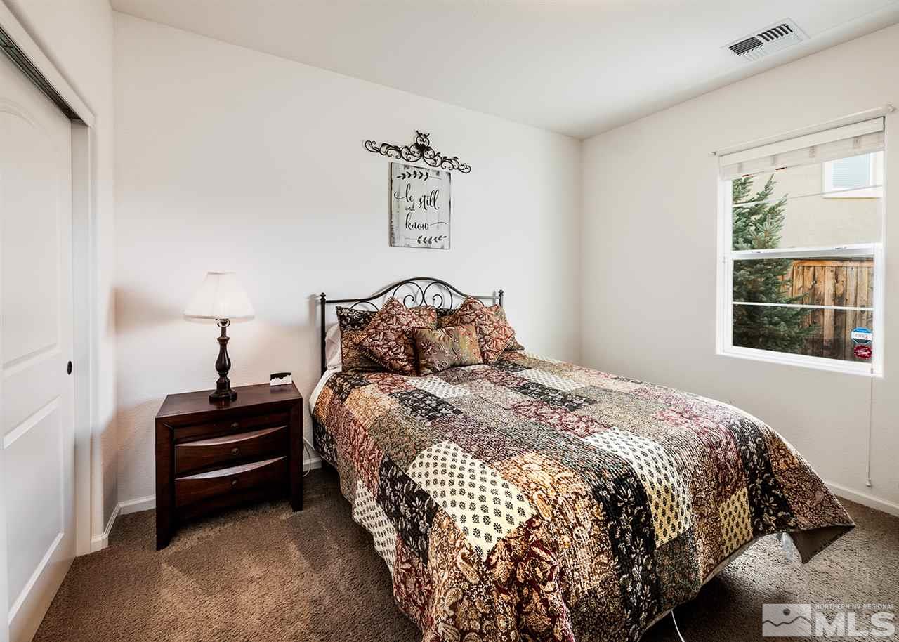 1640 Elk Run Trail Reno, NV 89523 - Photo 37 of 40 a bedroom with a bed and window