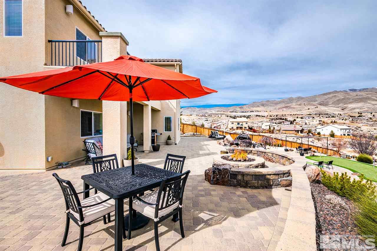 1640 Elk Run Trail Reno, NV 89523 - Photo 5 of 40 an outdoor space with furniture and umbrella