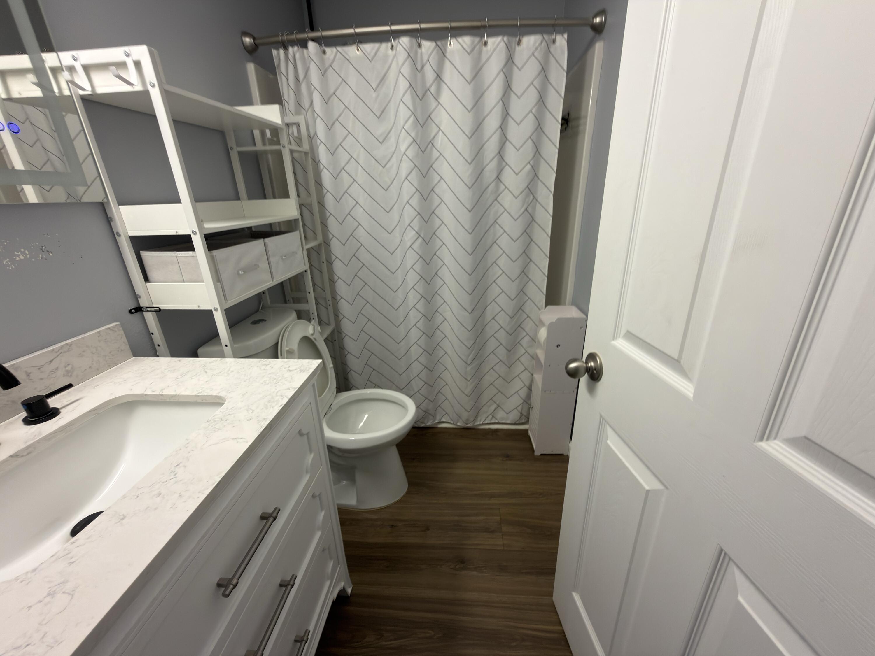 2673 Paddock Circle Crestview, FL 32536 - Photo 16 of 26 a bathroom with a sink and toilet