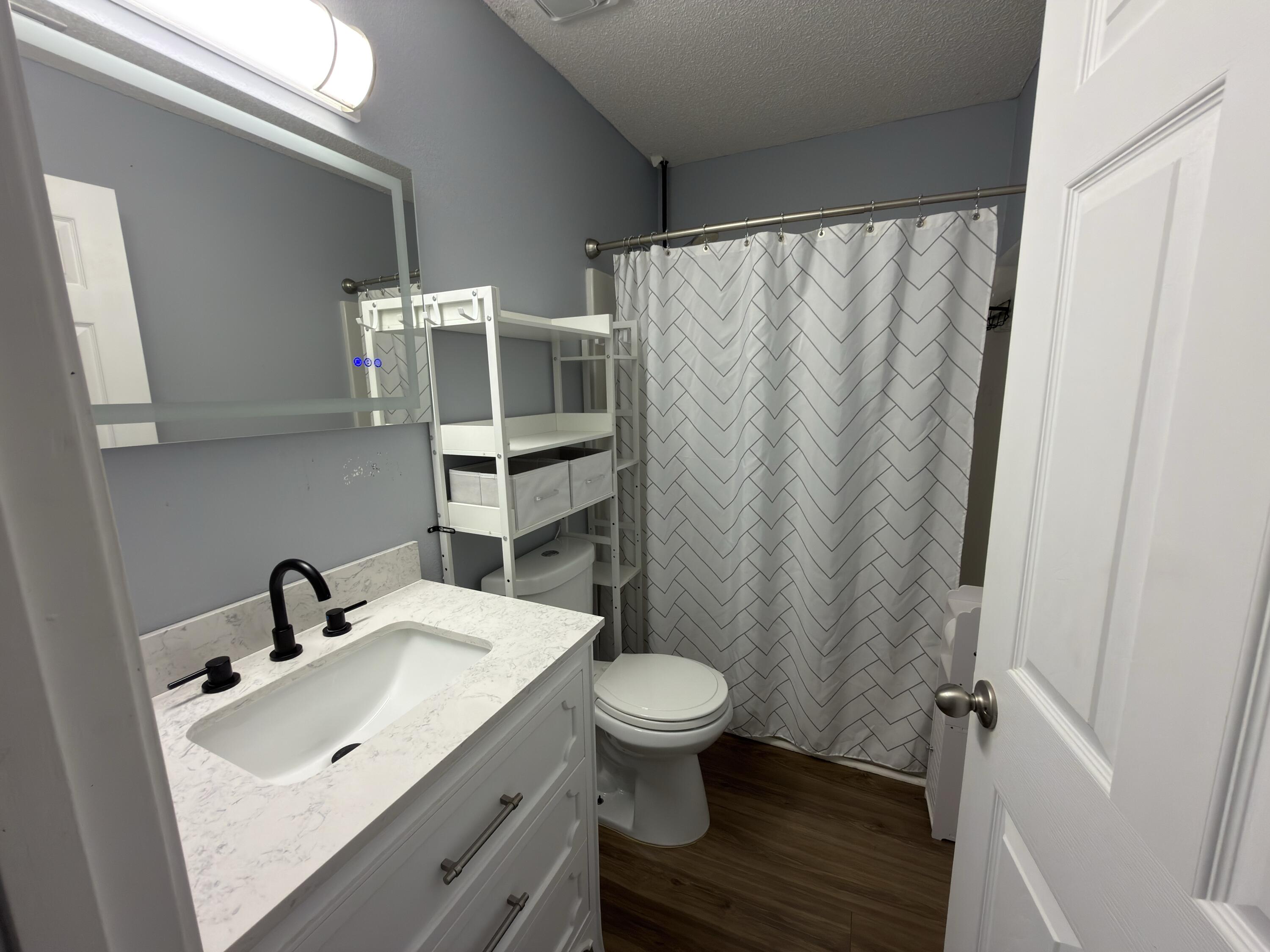 2673 Paddock Circle Crestview, FL 32536 - Photo 17 of 26 a bathroom with a sink and a toilet