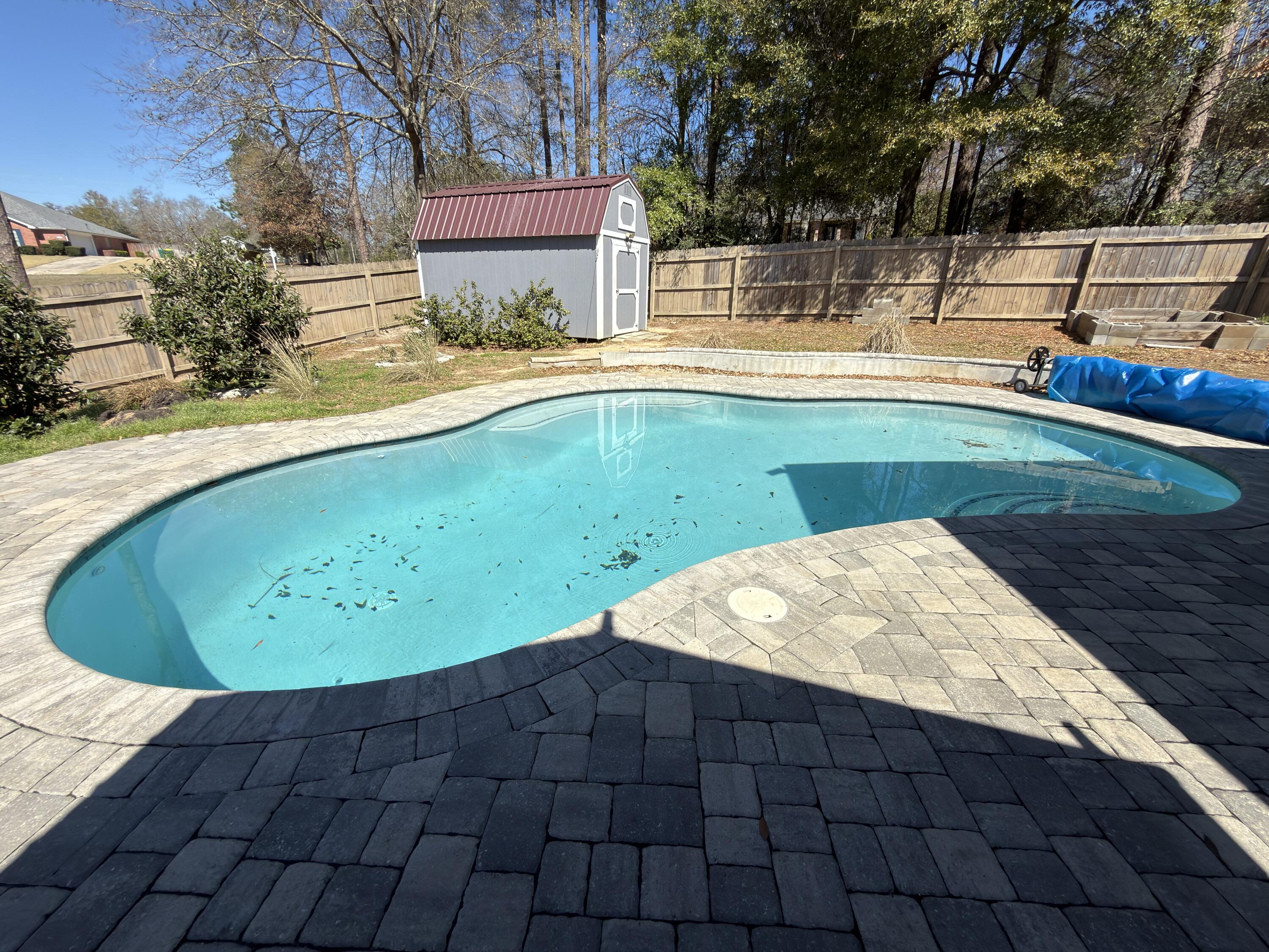2673 Paddock Circle Crestview, FL 32536 - Photo 20 of 26 a view of a swimming pool with a patio
