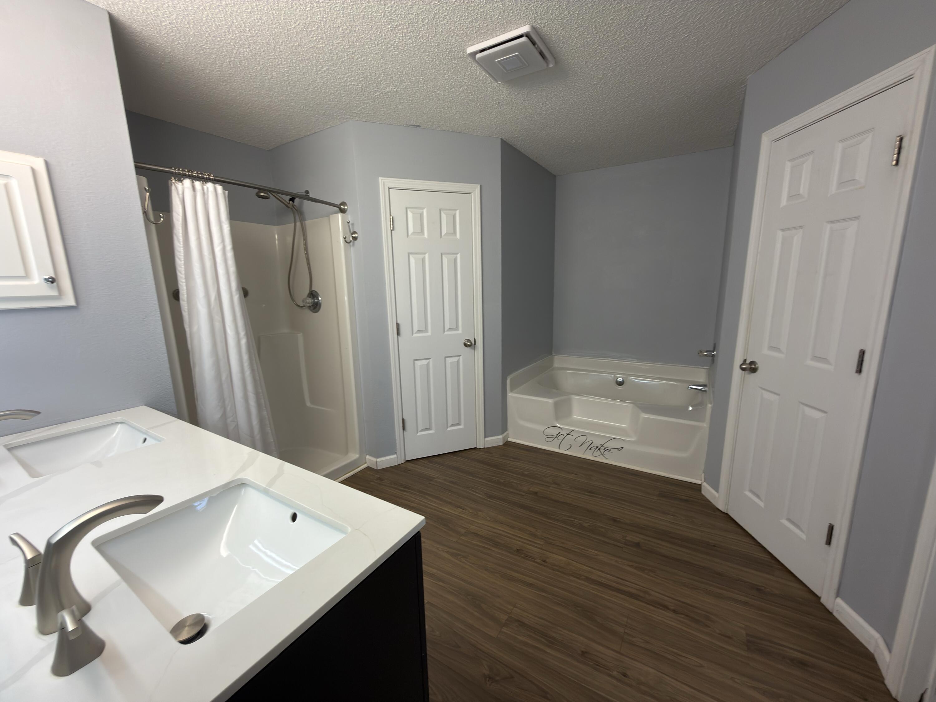 2673 Paddock Circle Crestview, FL 32536 - Photo 8 of 26 a bathroom with a sink toilet and shower