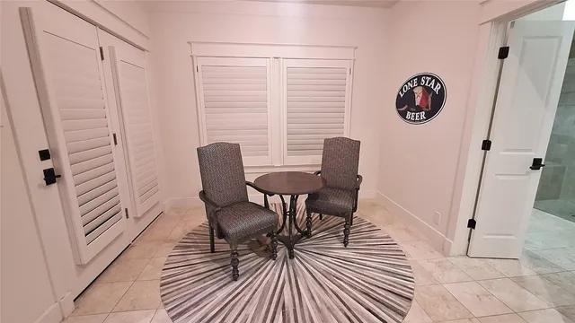a view of a room with a table and chair