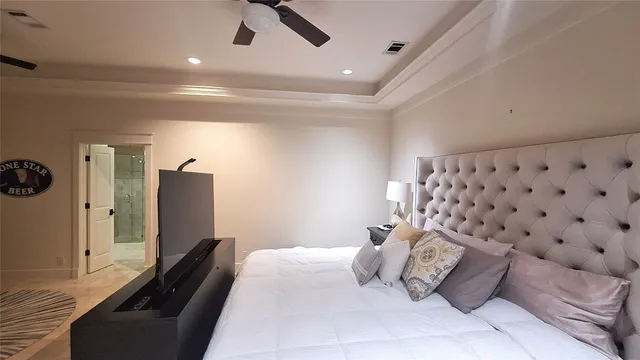 a bedroom with a bed and a couch