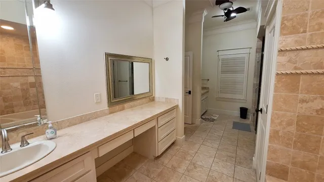 a spacious bathroom with a granite countertop sink mirror and shower