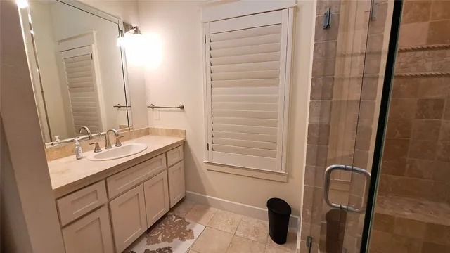 a bathroom with a double vanity sink a mirror and