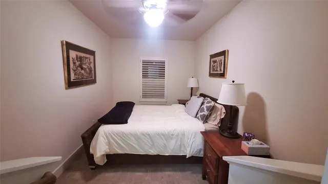 a bedroom with bed and a window