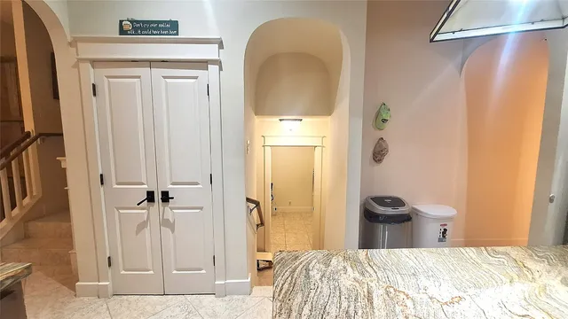 a bedroom with a bed and a mirror