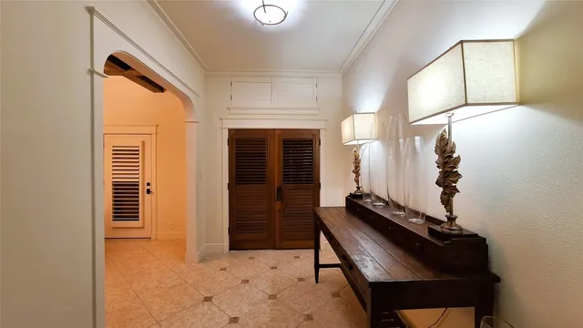 a view of a hallway with seating area