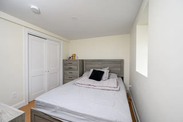 a bedroom with a bed and a cabinets