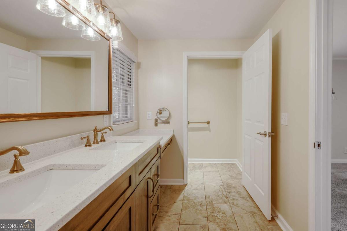 206 Fortson Drive Athens, GA 30606 - Photo 20 of 38 a bathroom with a sink a vanity and a mirror