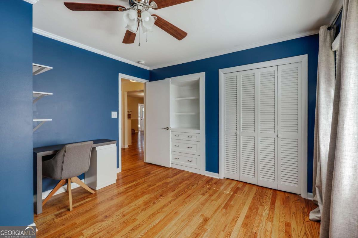 206 Fortson Drive Athens, GA 30606 - Photo 23 of 38 a view of a livingroom with wooden floor and a ceiling fan