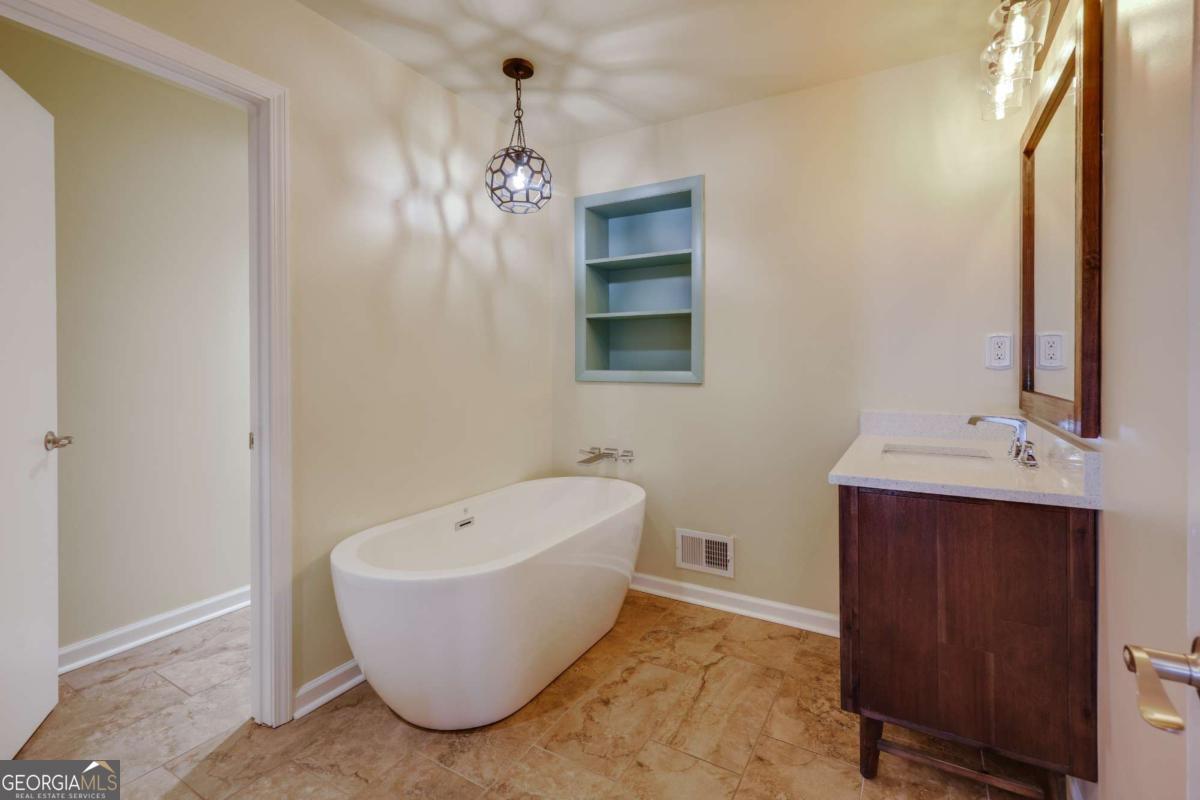 206 Fortson Drive Athens, GA 30606 - Photo 25 of 38 a bathroom with a bathtub and sink