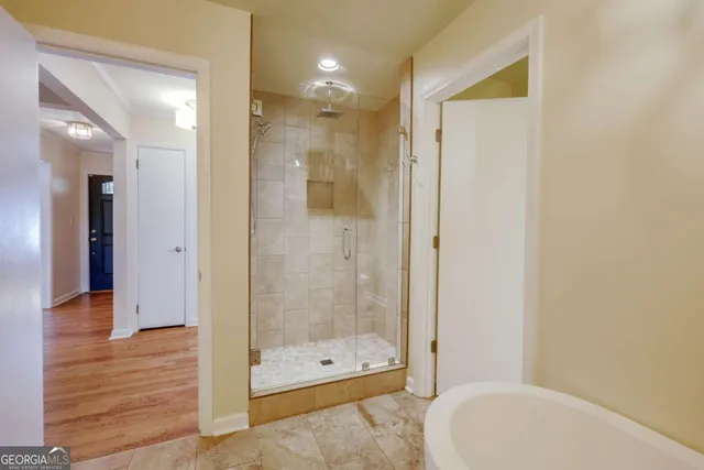 a bathroom with a shower and a toilet